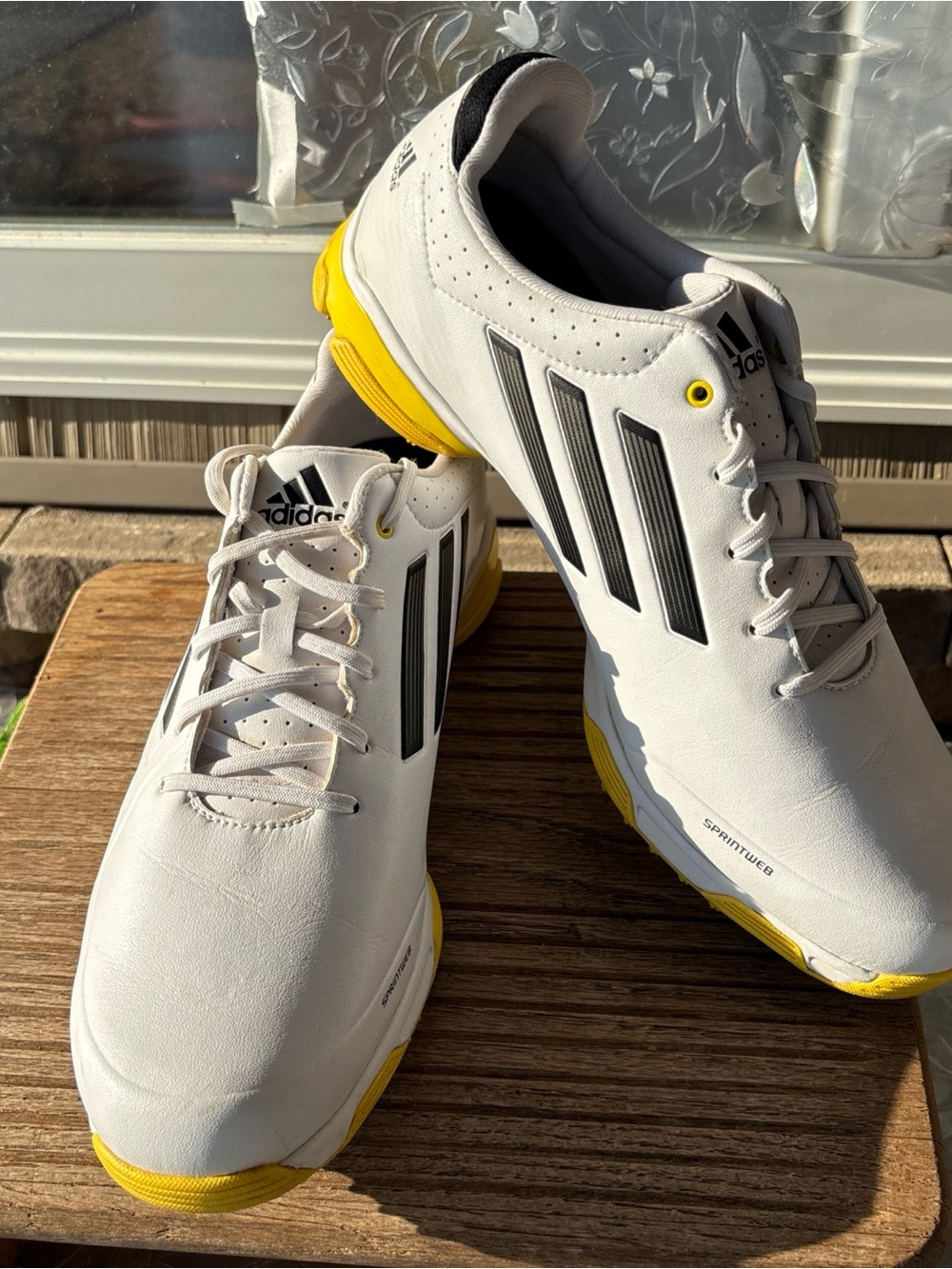 adidas White Athletic Shoes with Yellow Accents and Black Stripes golf shoes
